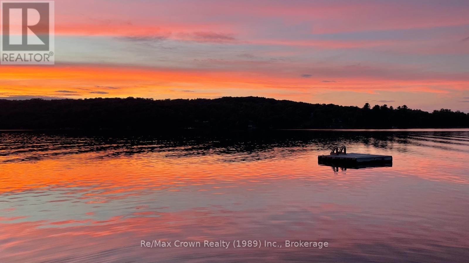 Beautiful sunsent standing on Dock - 294 Everett Drive, Parry Sound Remote Area (Restoule), ON - Outdoor With Body Of Water With View