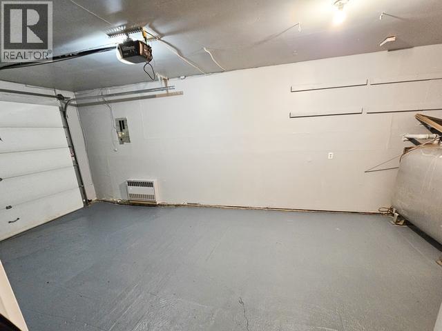 620 Yates Crescent, Faro, YT - Indoor Photo Showing Garage