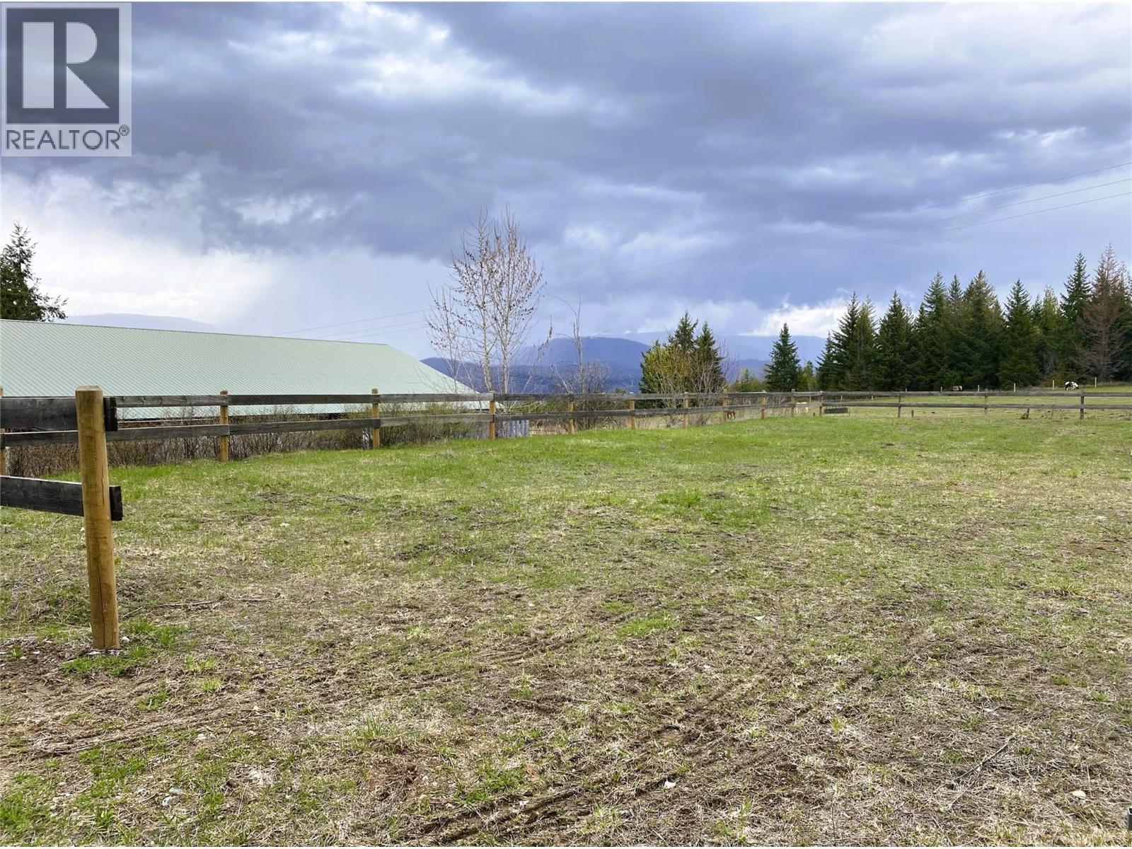 75' x 130' Arena looking toward Barn - 1403 Notch Hill Road, Sorrento, BC