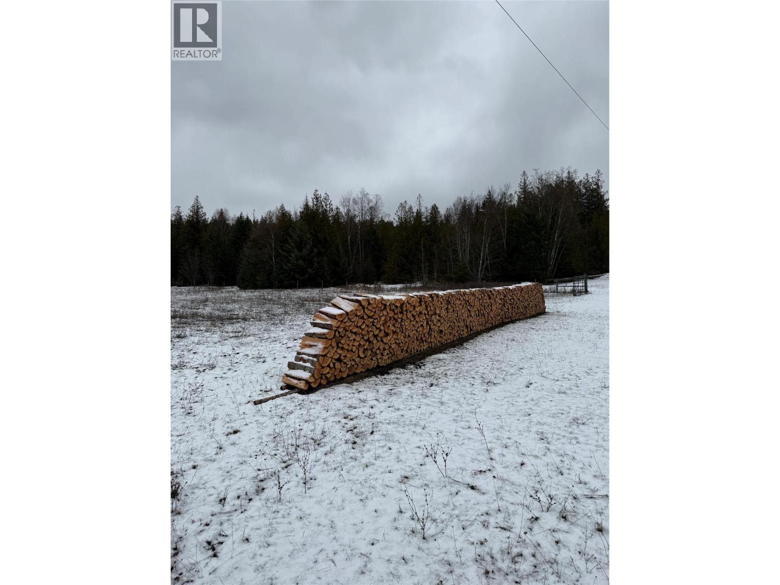 Winter Firewood in upper fields - 1403 Notch Hill Road, Sorrento, BC
