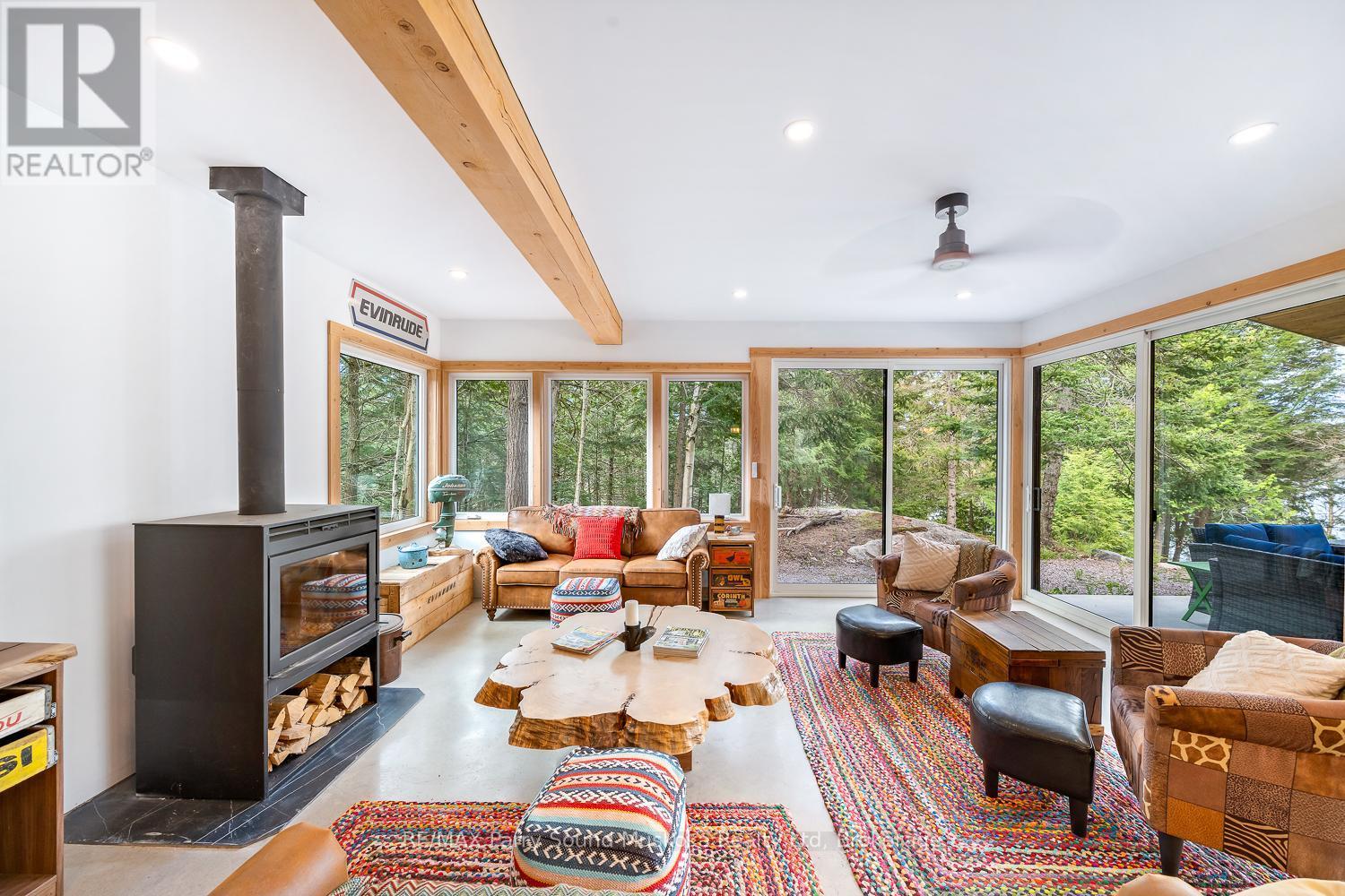 13 Labrash Lake Road, Whitestone, ON - Indoor Photo Showing Living Room With Fireplace