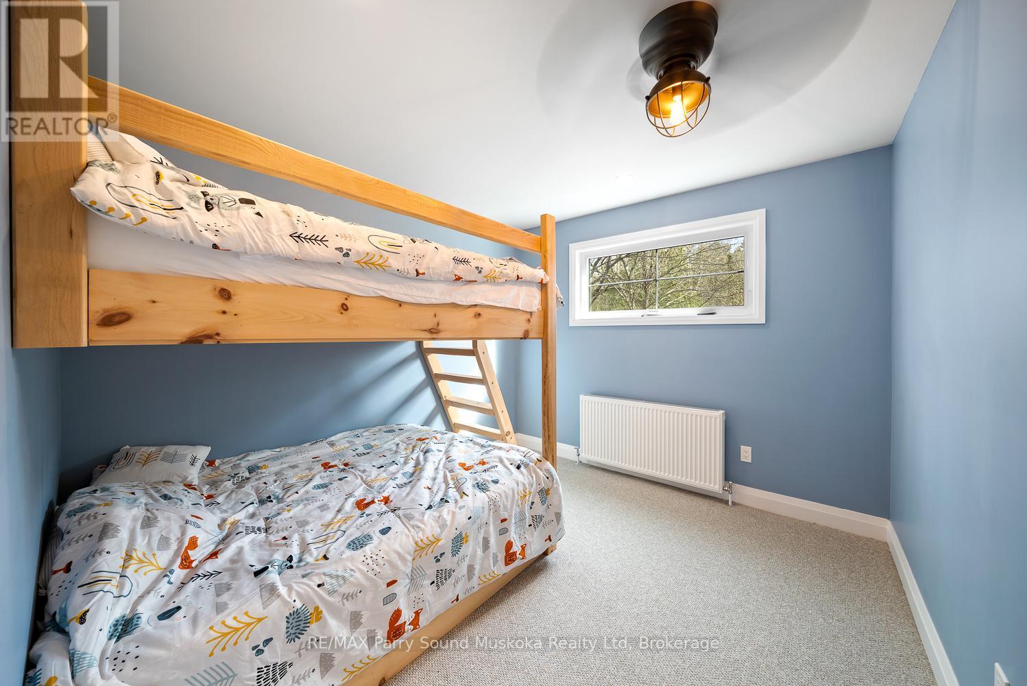 13 Labrash Lake Road, Whitestone, ON - Indoor Photo Showing Bedroom