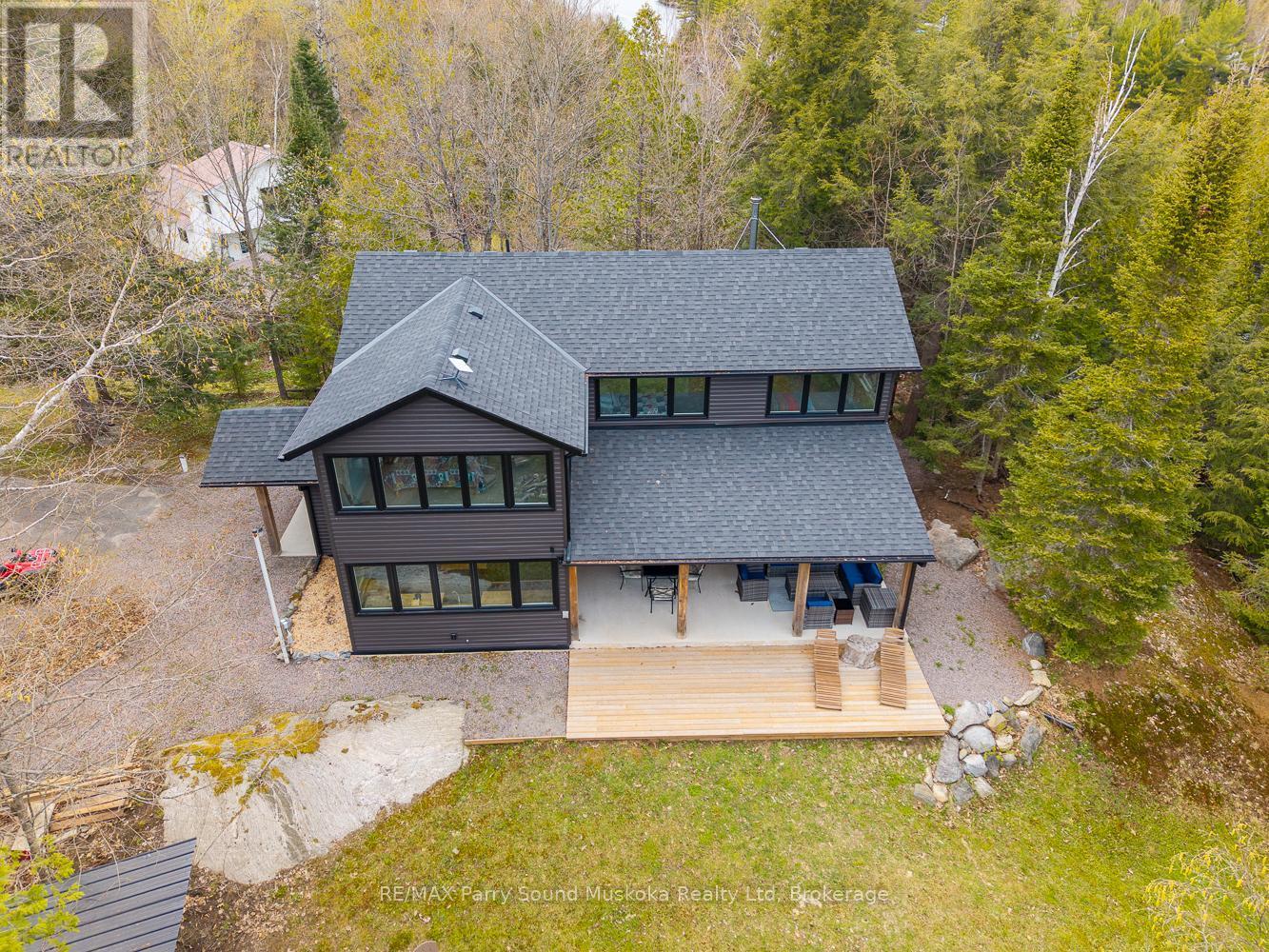 13 Labrash Lake Road, Whitestone, ON - Outdoor With Facade