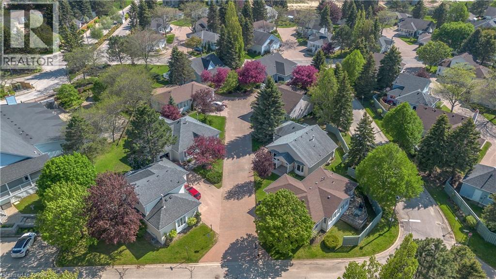 Residential neighborhood featuring diverse architectural styles, mature trees, and green landscaping - 375 Silverbirch Boulevard, Hamilton, ON - Outdoor With View