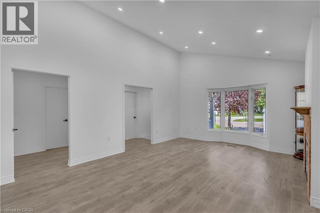 Expansive living area featuring vaulted ceilings and recessed lighting - 375 Silverbirch Boulevard, Hamilton, ON - Indoor Photo Showing Other Room