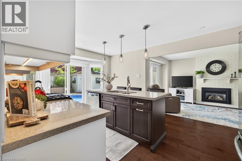 108 Old Forest Crescent, Kitchener, ON - Indoor Photo Showing Kitchen With Fireplace With Double Sink
