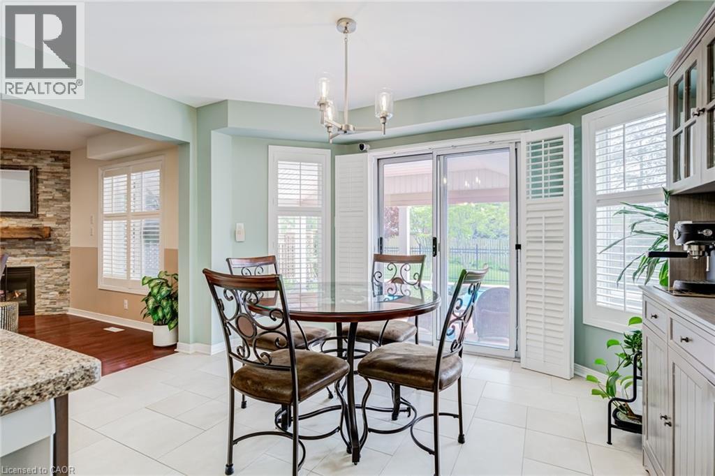 82 Vansickle Road, St. Catharines, ON - Indoor Photo Showing Dining Room With Fireplace