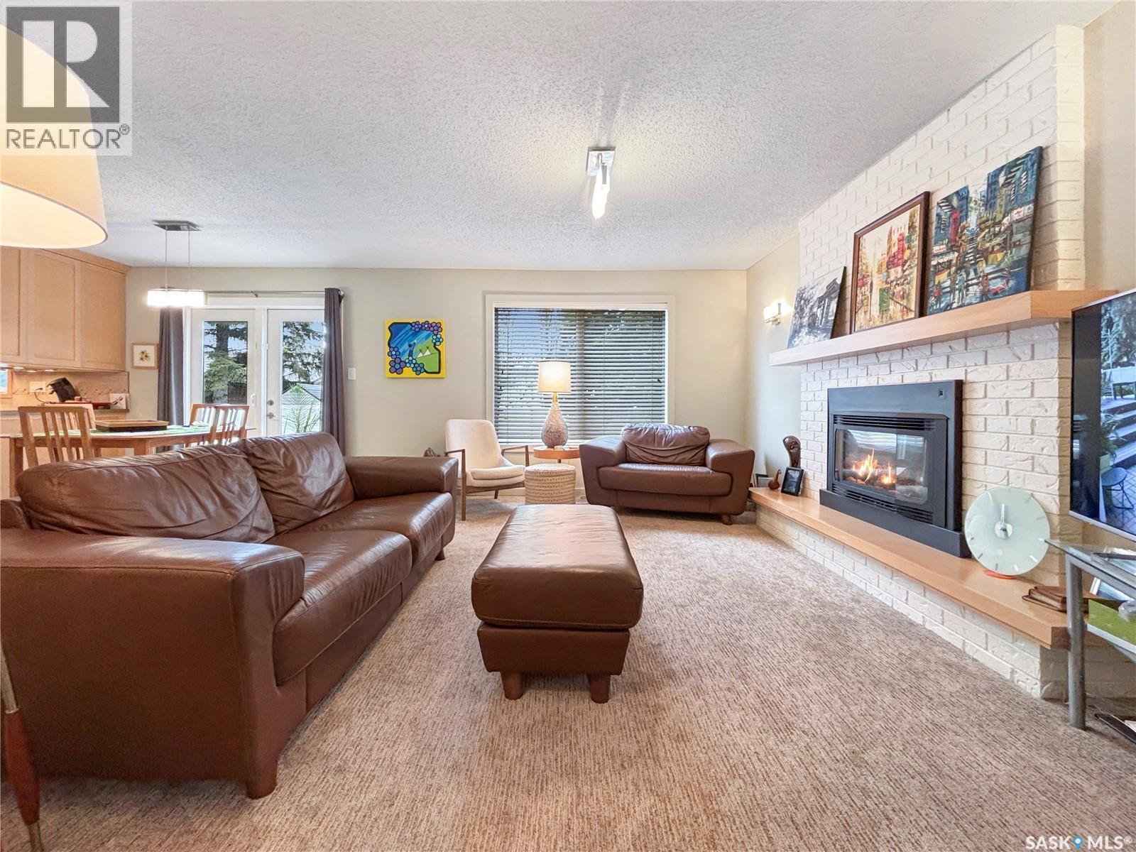 355 Ball Crescent, Saskatoon, SK - Indoor Photo Showing Living Room With Fireplace