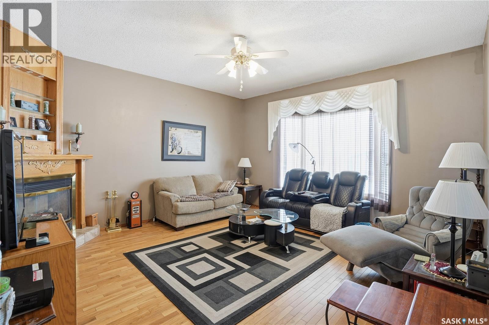 210 Railway Avenue, Mortlach, SK - Indoor Photo Showing Living Room With Fireplace