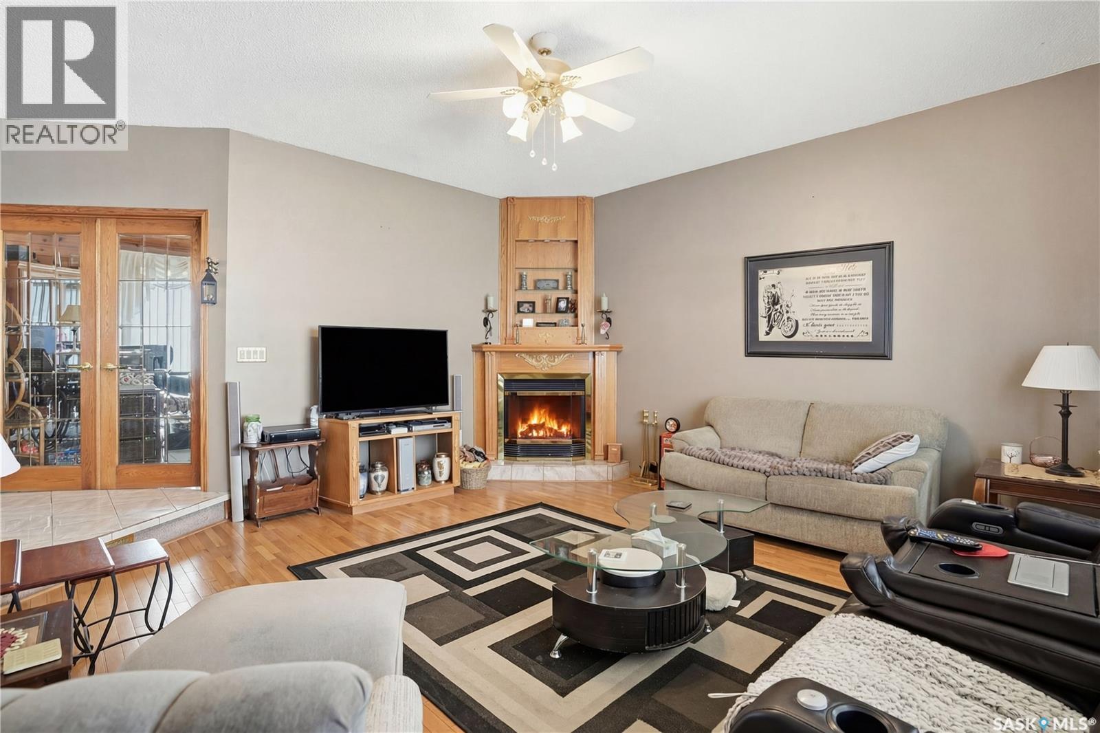 210 Railway Avenue, Mortlach, SK - Indoor Photo Showing Living Room With Fireplace