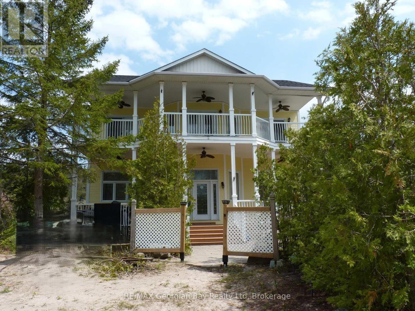 Front View of Home - 1107 Tiny Beaches Road S, Tiny, ON - Outdoor With Balcony