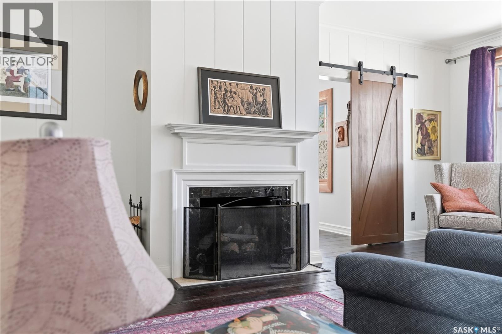 208 Saskatchewan Crescent W, Saskatoon, SK - Indoor Photo Showing Living Room With Fireplace