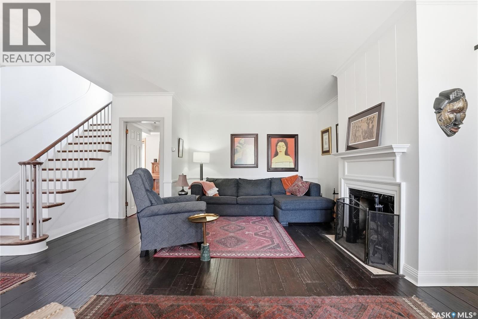 208 Saskatchewan Crescent W, Saskatoon, SK - Indoor Photo Showing Living Room With Fireplace
