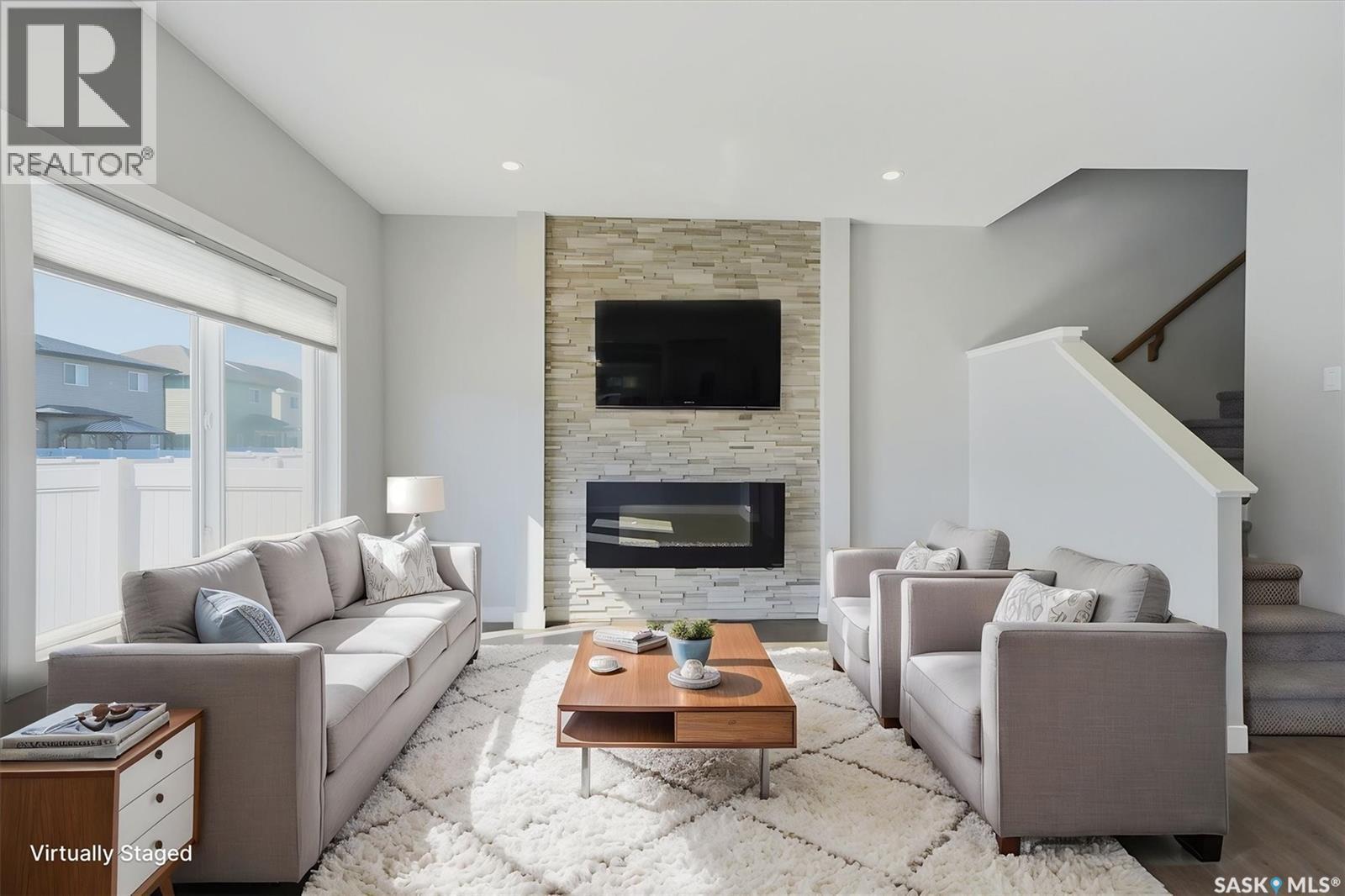 348 Brighton Gate, Saskatoon, SK - Indoor Photo Showing Living Room With Fireplace