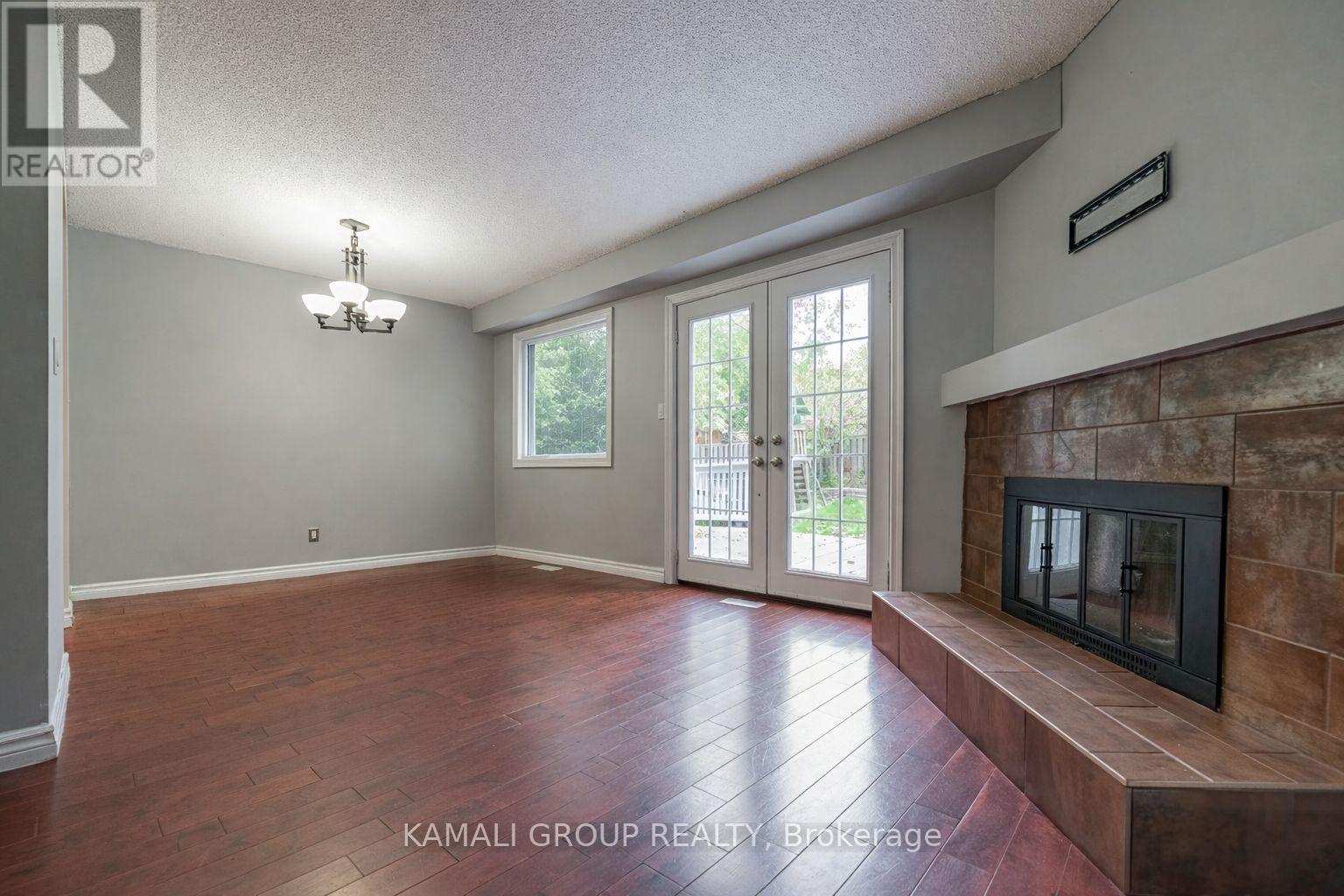 Walkout to Patio & Large Yard - Main - 77 Ecclestone Drive, Brampton, ON - Indoor With Fireplace