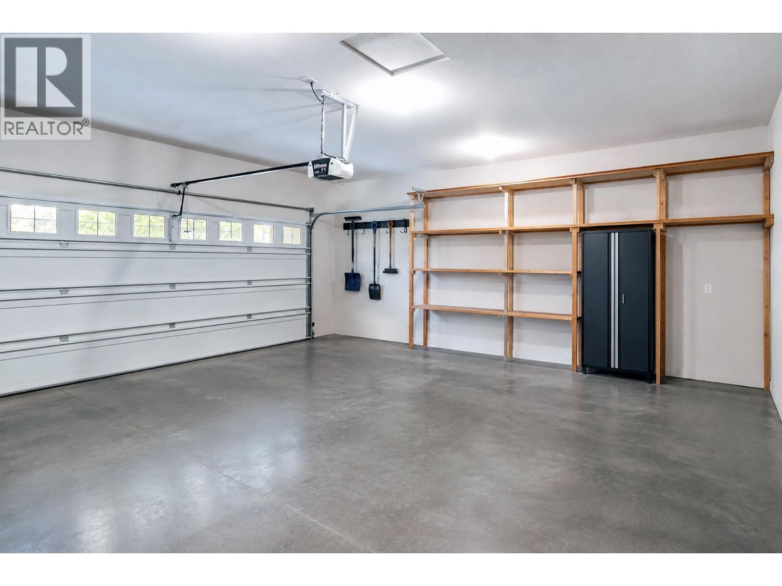 VIRTUALLY STAGED - 4520 Gallaghers Lookout Unit# 4, Kelowna, BC - Indoor Photo Showing Garage