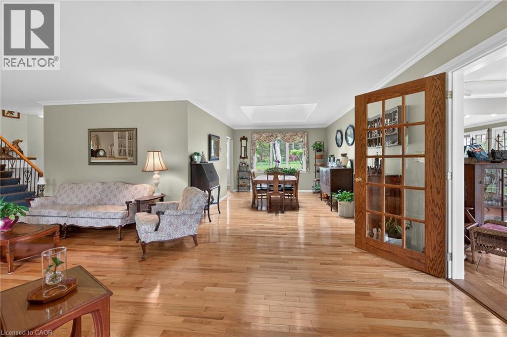 Hardwood flooring extends throughout this expansive main living area - 2 Summit Circle, Simcoe, ON - Indoor Photo Showing Living Room