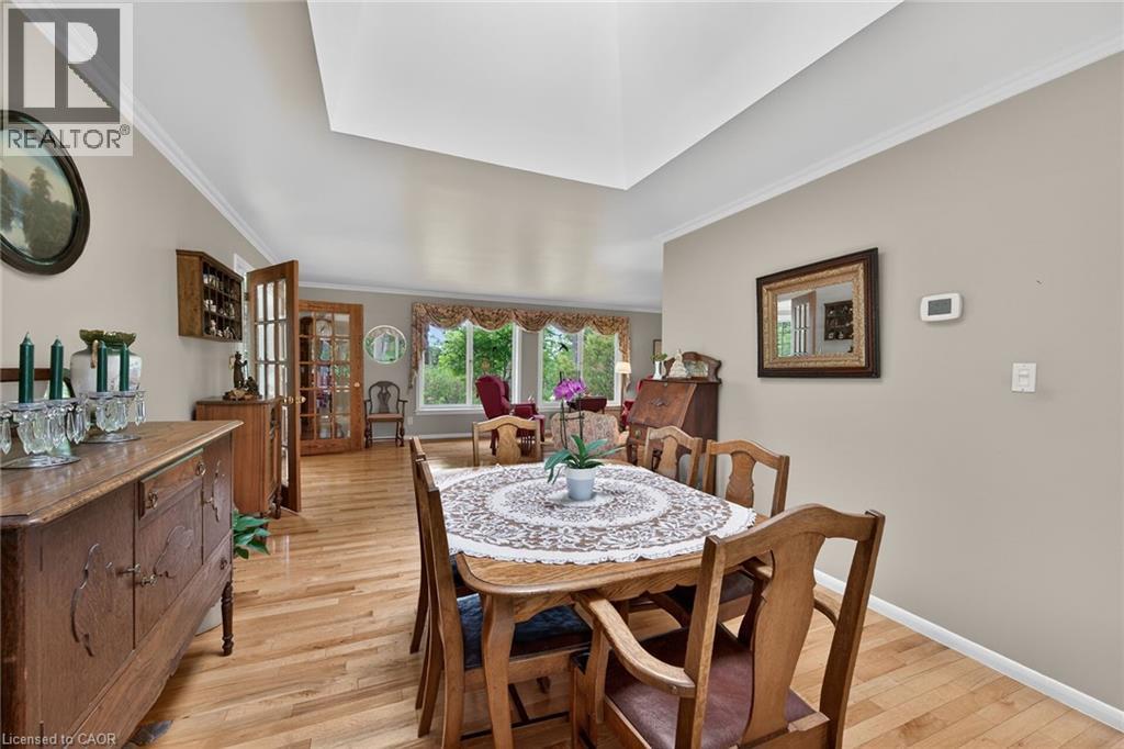 Dining area with hardwood flooring and a vaulted ceiling - 2 Summit Circle, Simcoe, ON - Indoor Photo Showing Dining Room
