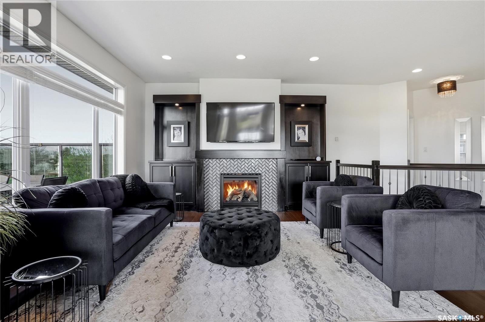2431 Linner Bay, Regina, SK - Indoor Photo Showing Living Room With Fireplace