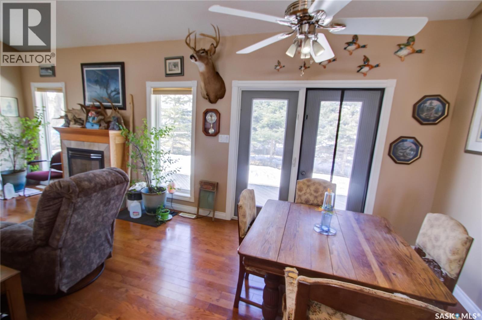 120 1St Avenue E, Love, SK - Indoor Photo Showing Dining Room With Fireplace