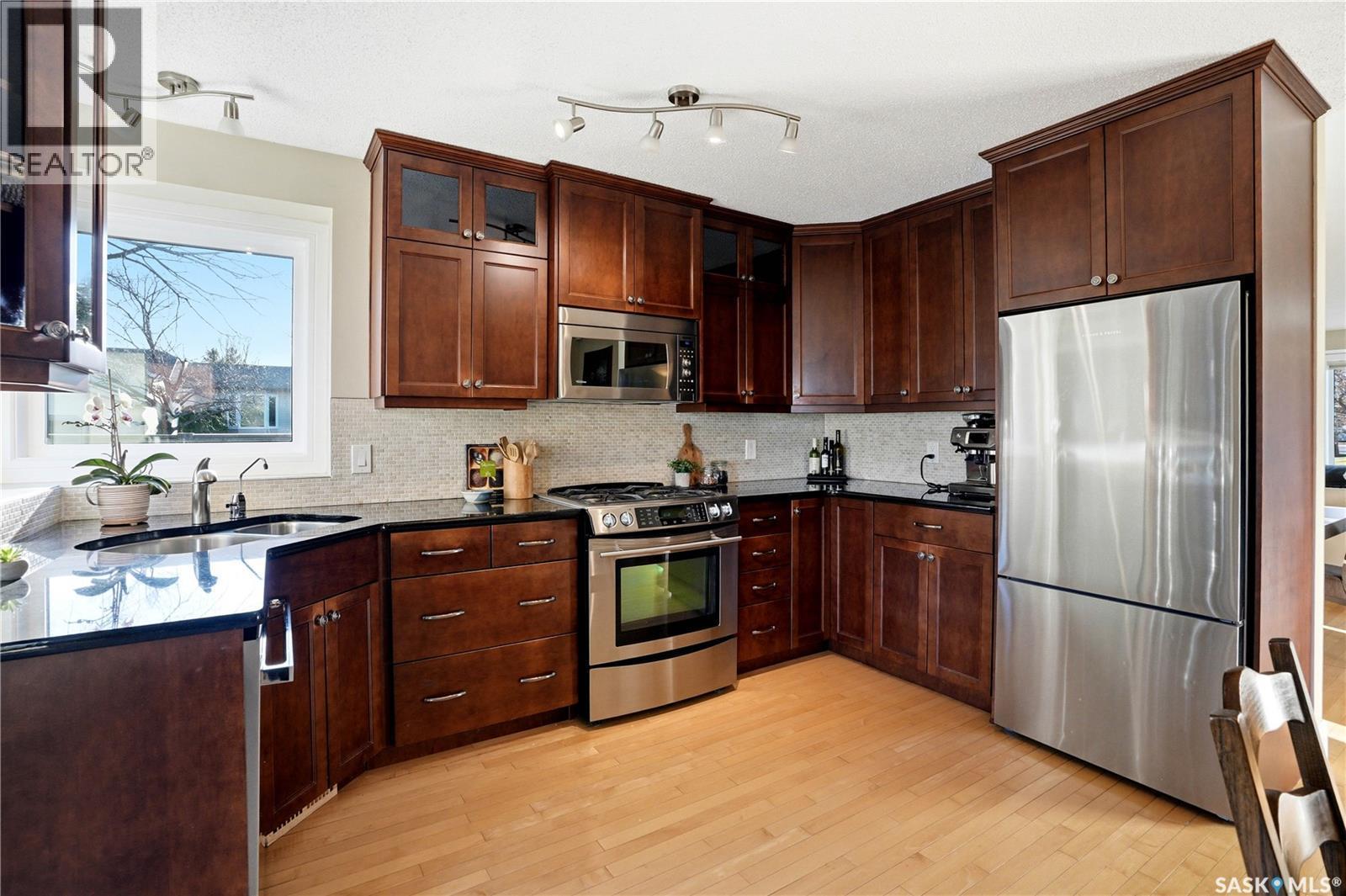 239 Scissons Court, Saskatoon, SK - Indoor Photo Showing Kitchen With Double Sink