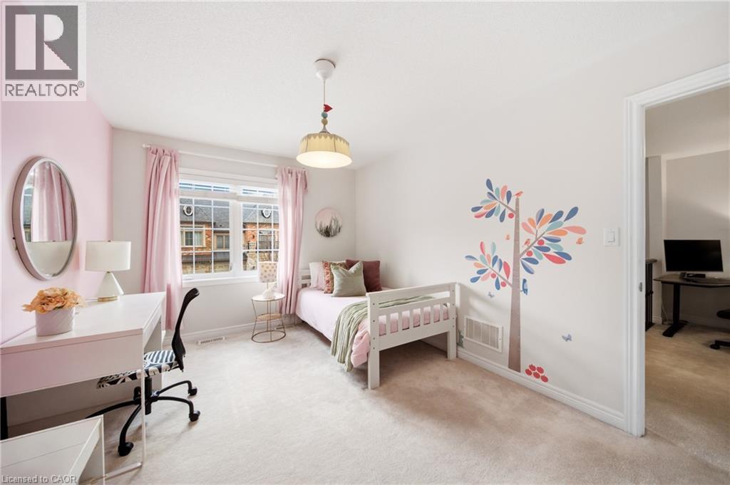 Carpeted room with a multi-pane window and light-colored walls - 2466 Village Common, Oakville, ON - Indoor Photo Showing Bedroom