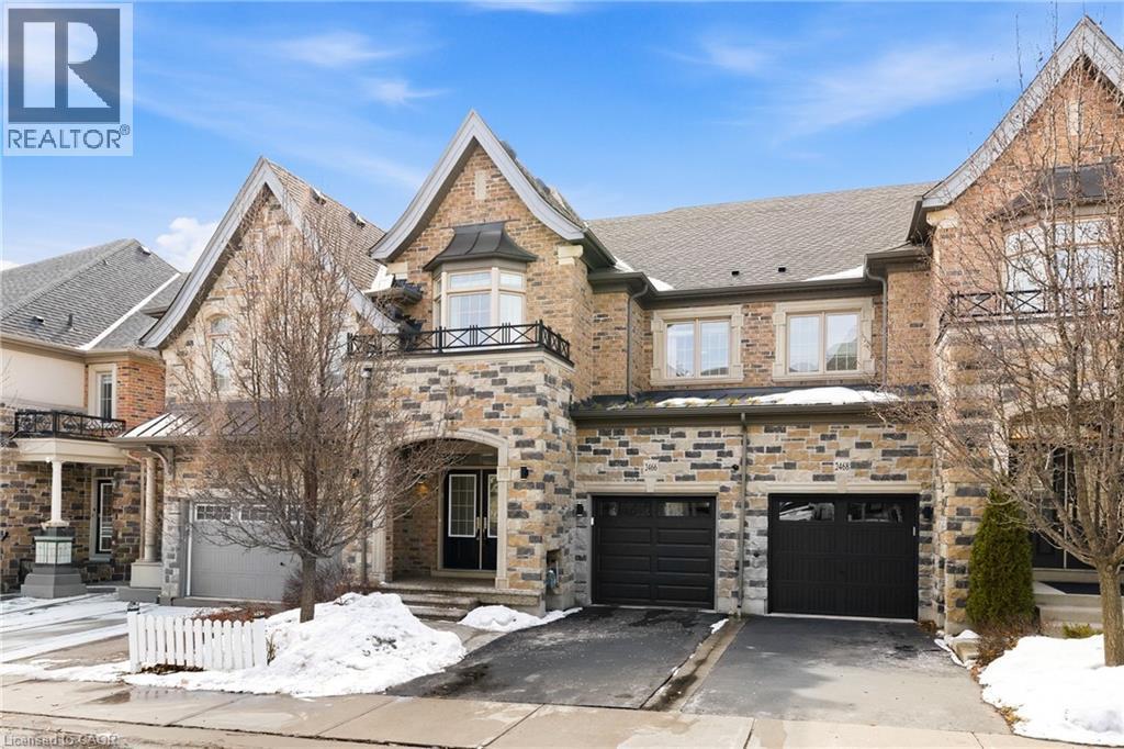 Stone and brick facade with gabled roof lines - 2466 Village Common, Oakville, ON - Outdoor With Facade