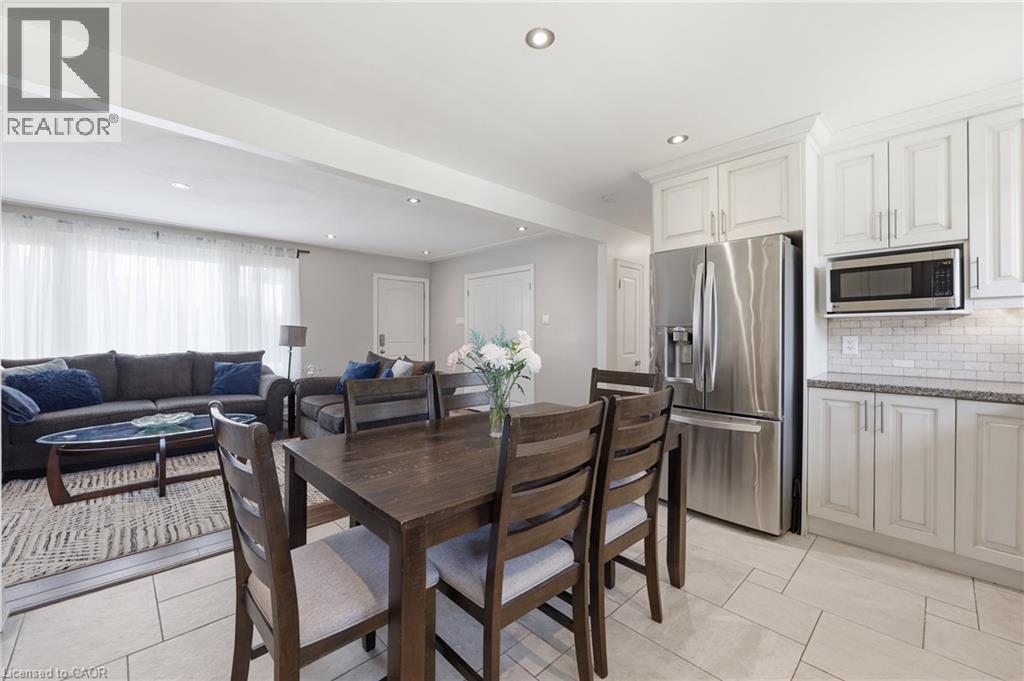 Open-concept living space featuring a dining area, kitchen, and living room - 168 Nugent Drive, Hamilton, ON - Indoor