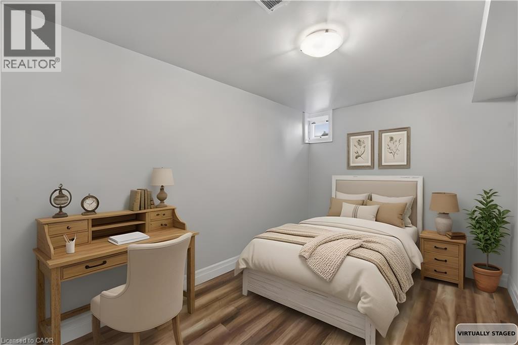 Room featuring wood-finish flooring and light gray walls - 168 Nugent Drive, Hamilton, ON - Indoor Photo Showing Bedroom