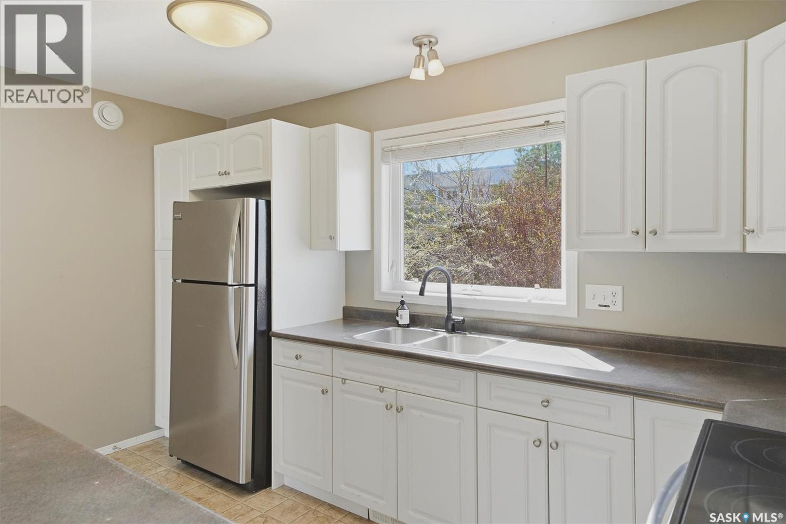 315A 109Th Street, Saskatoon, SK - Indoor Photo Showing Kitchen With Double Sink
