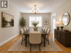 Dining area featuring wood-finish flooring, a contemporary chandelier, two windows with white plantation shutters, and an entryway with white trim -