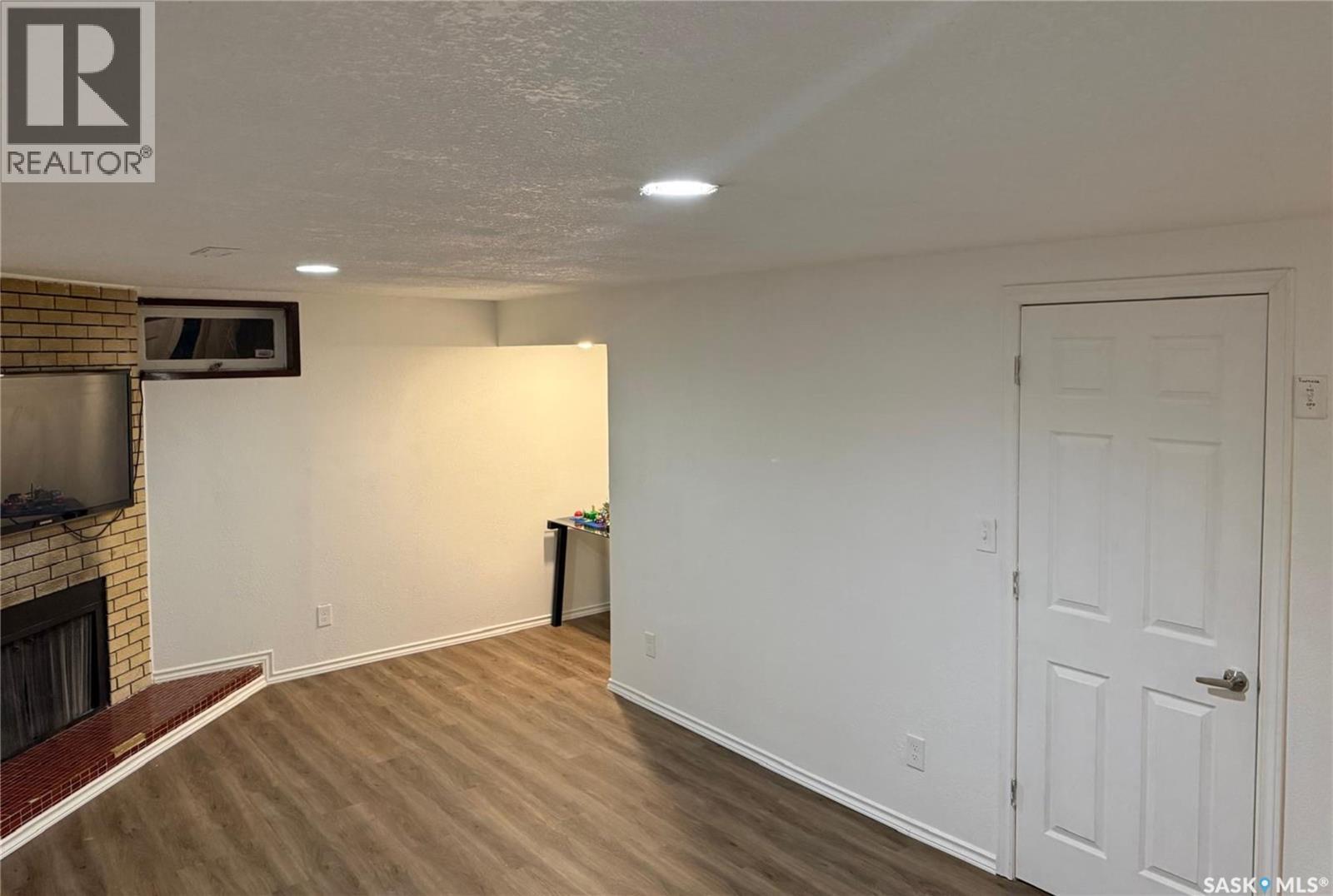 1341 9Th Avenue N, Regina, SK - Indoor Photo Showing Other Room With Fireplace