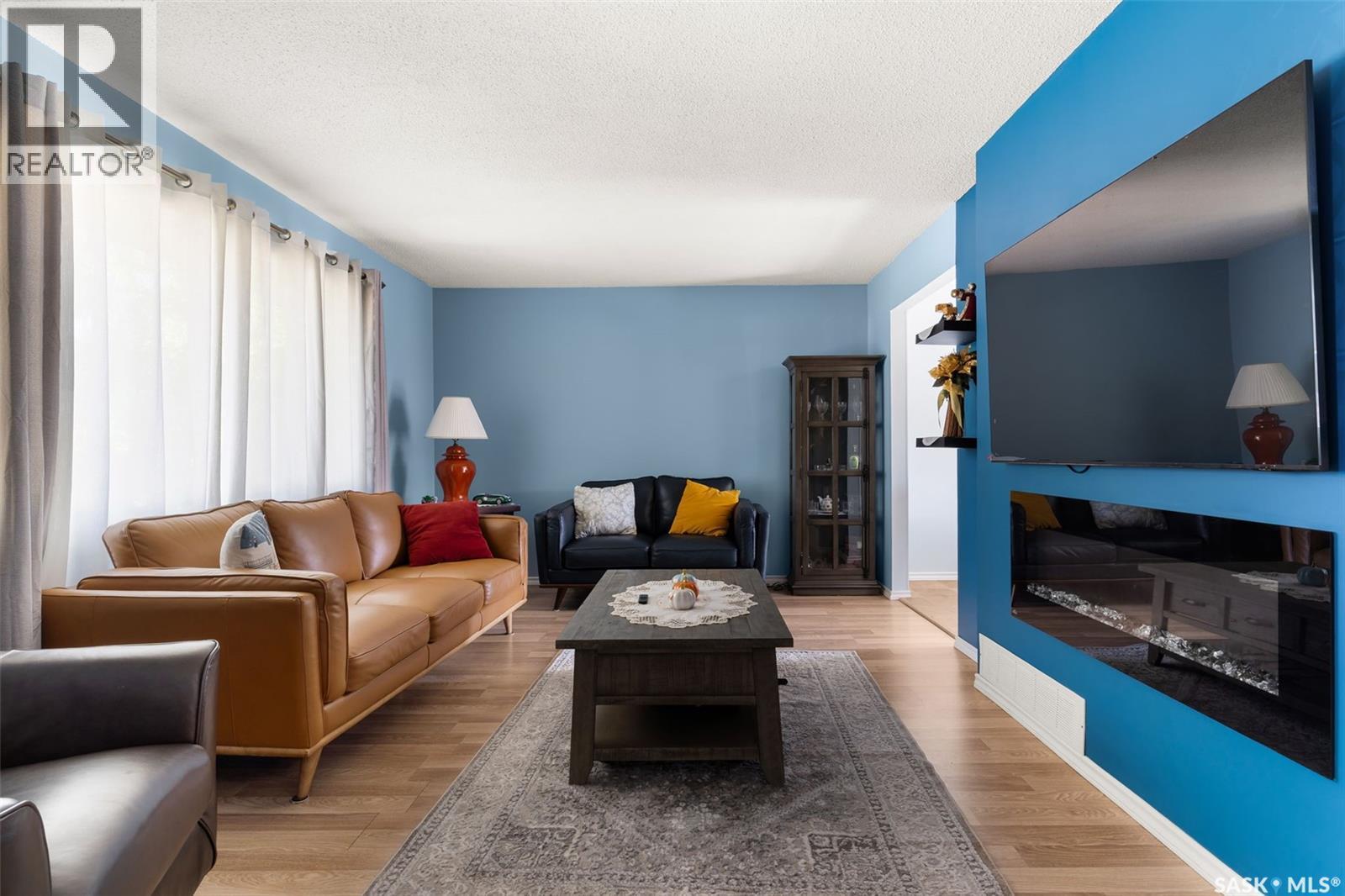 1341 9Th Avenue N, Regina, SK - Indoor Photo Showing Living Room With Fireplace