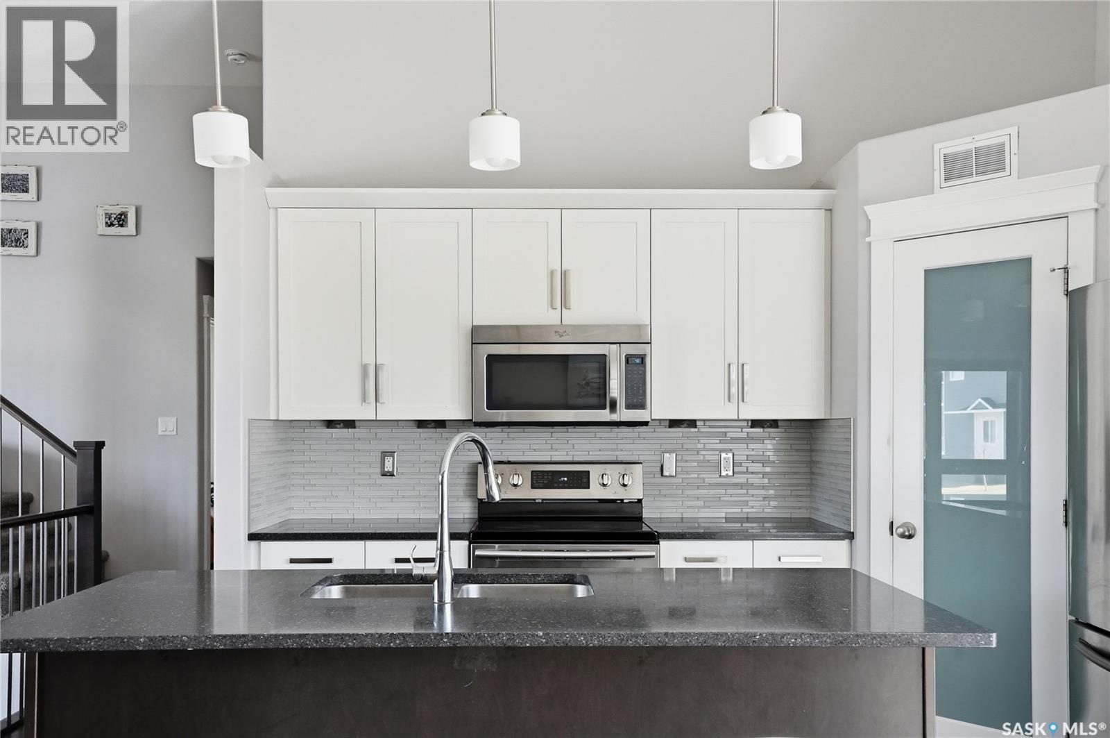 1111 Evergreen Boulevard, Saskatoon, SK - Indoor Photo Showing Kitchen With Upgraded Kitchen
