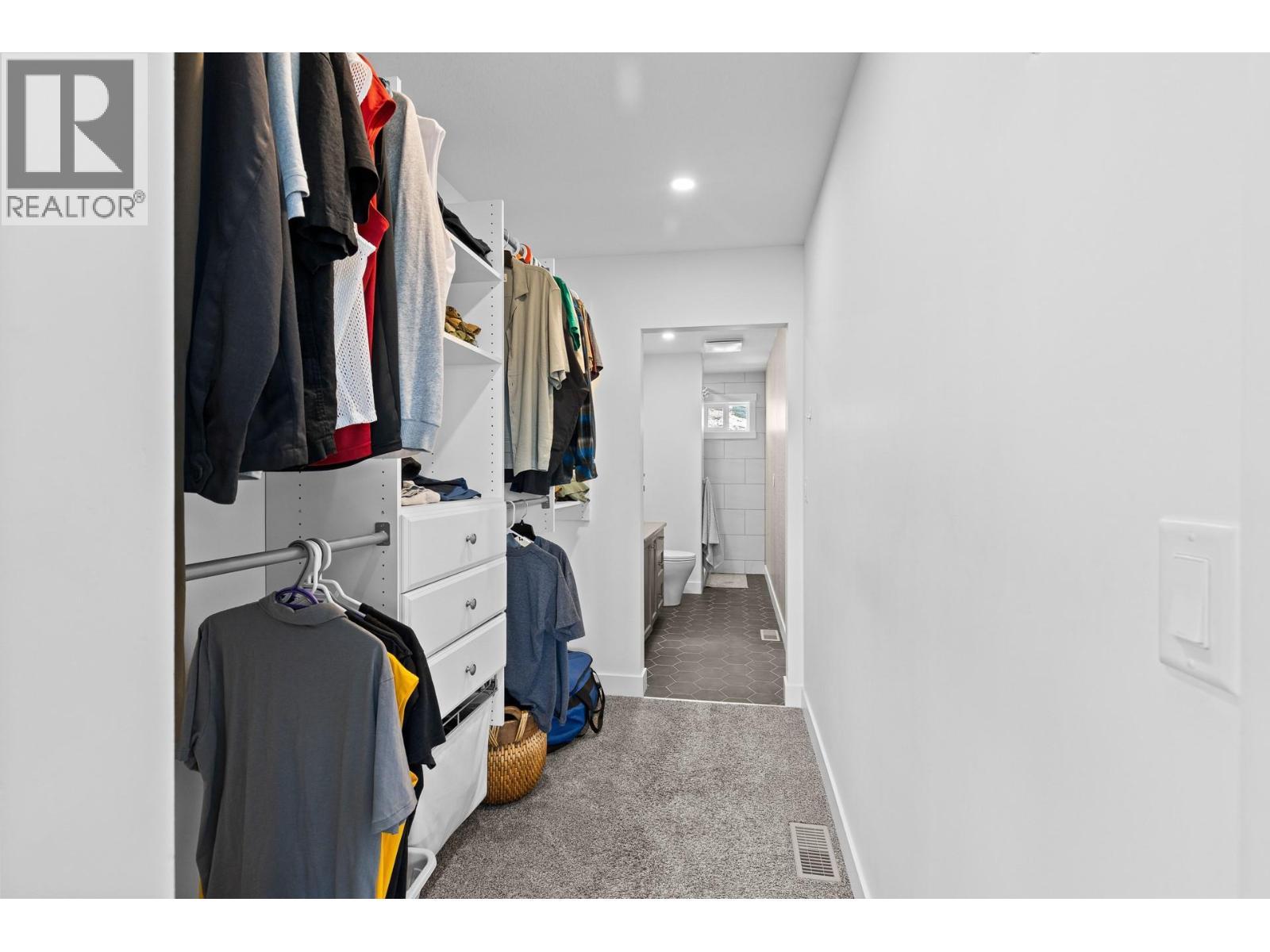 His closet off ensuite. - 647 Mt Ida Drive, Coldstream, BC