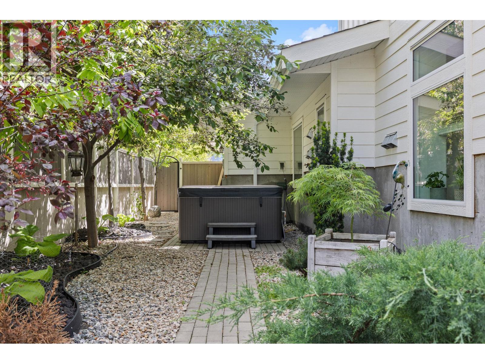 Main home access to backyard with hot tub. - 647 Mt Ida Drive, Coldstream, BC