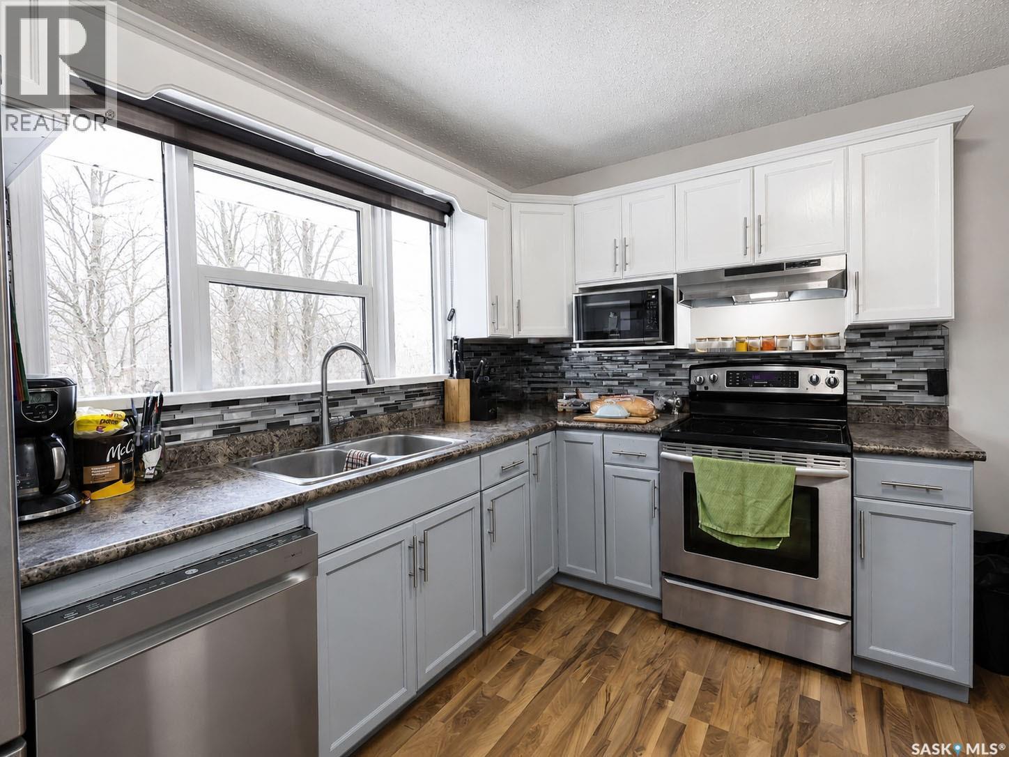 312 20Th Street E, Prince Albert, SK - Indoor Photo Showing Kitchen With Stainless Steel Kitchen With Double Sink