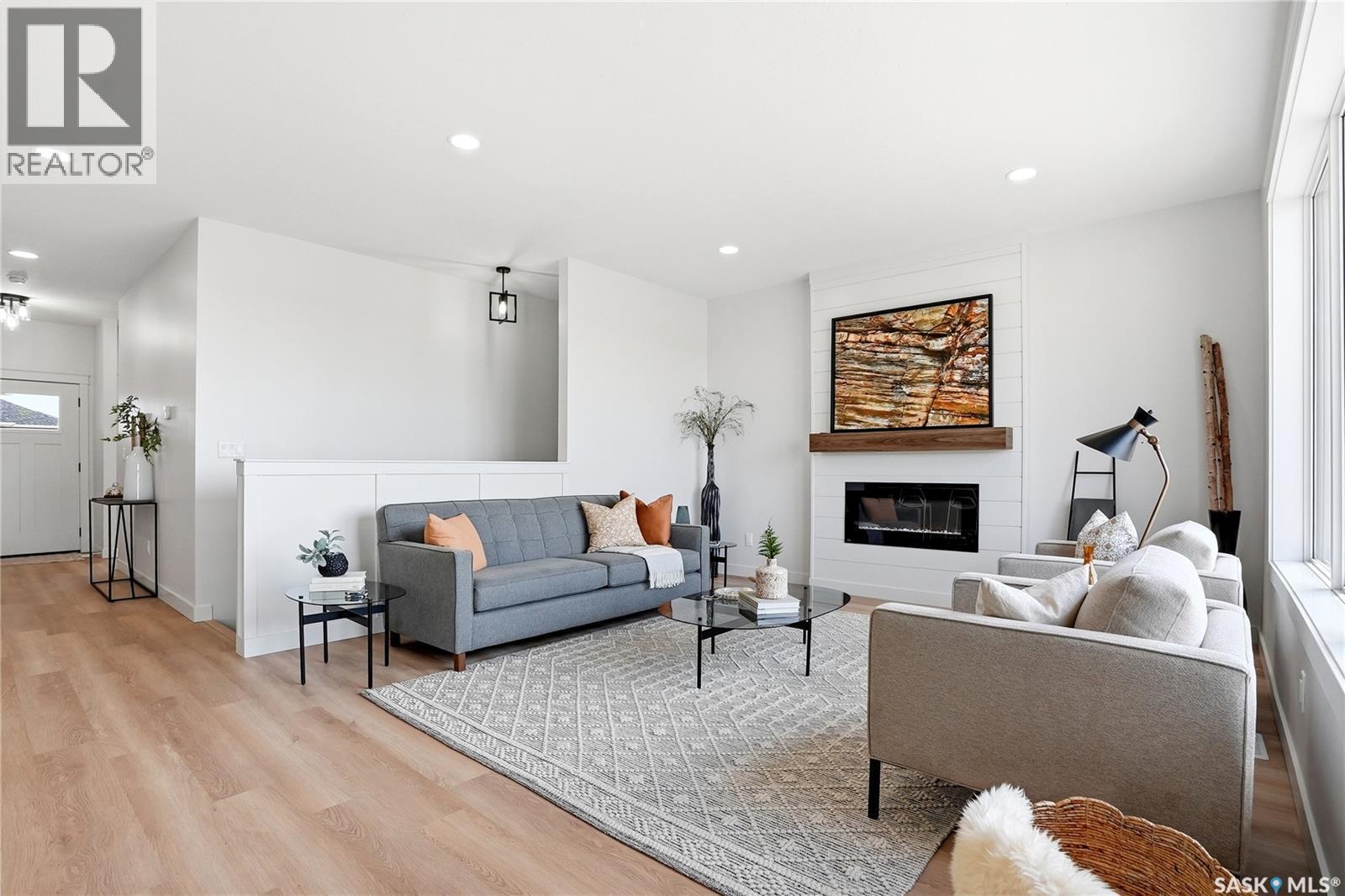 3 Walker Way, Clavet, SK - Indoor Photo Showing Living Room With Fireplace