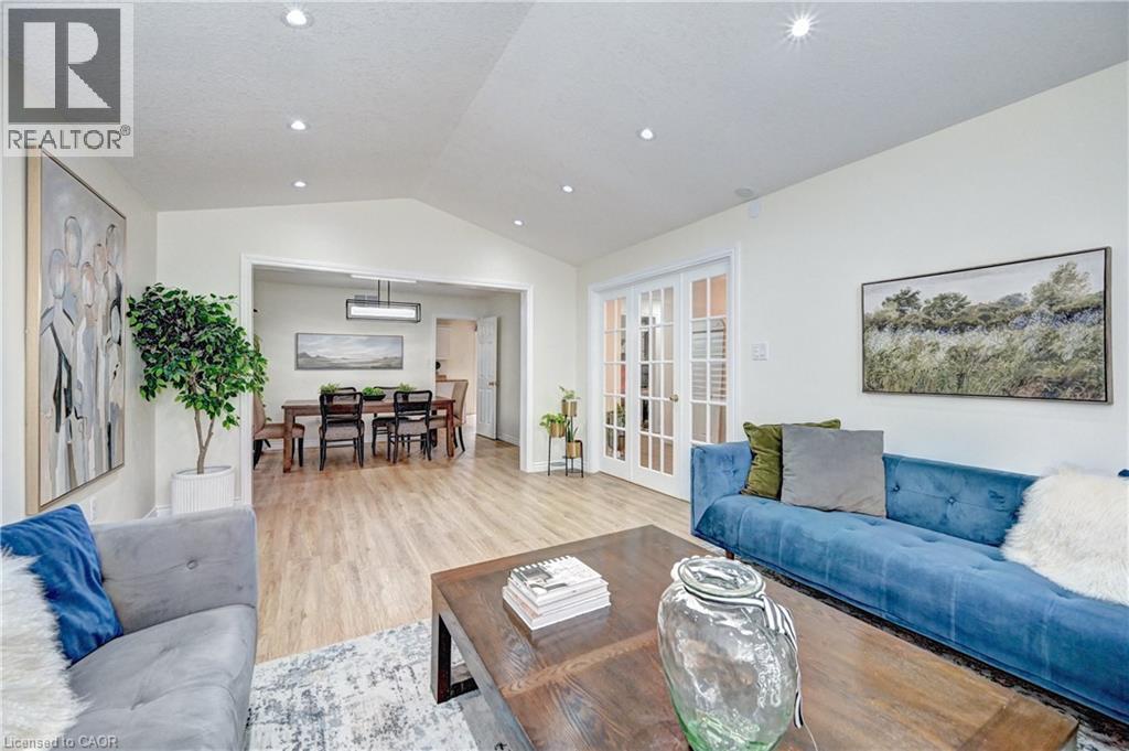 Living area with light wood-finish flooring and recessed lighting - 519 Yorkshire Drive, Waterloo, ON - Indoor Photo Showing Living Room