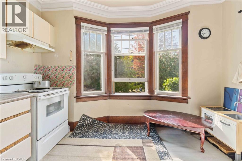 Bay window with natural wood trim and multiple panes - 151 Louisa Street, Kitchener, ON - Indoor Photo Showing Kitchen