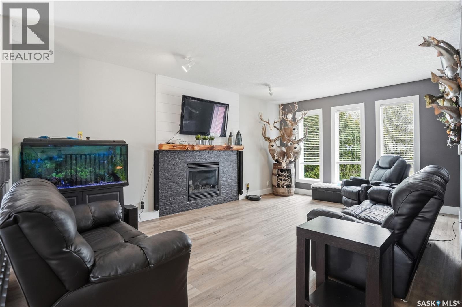 165 3Rd Street, Pilot Butte, SK - Indoor Photo Showing Living Room With Fireplace