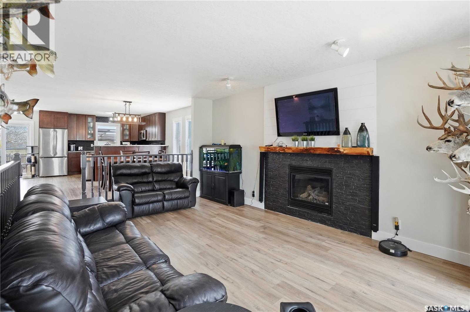 165 3Rd Street, Pilot Butte, SK - Indoor Photo Showing Living Room With Fireplace