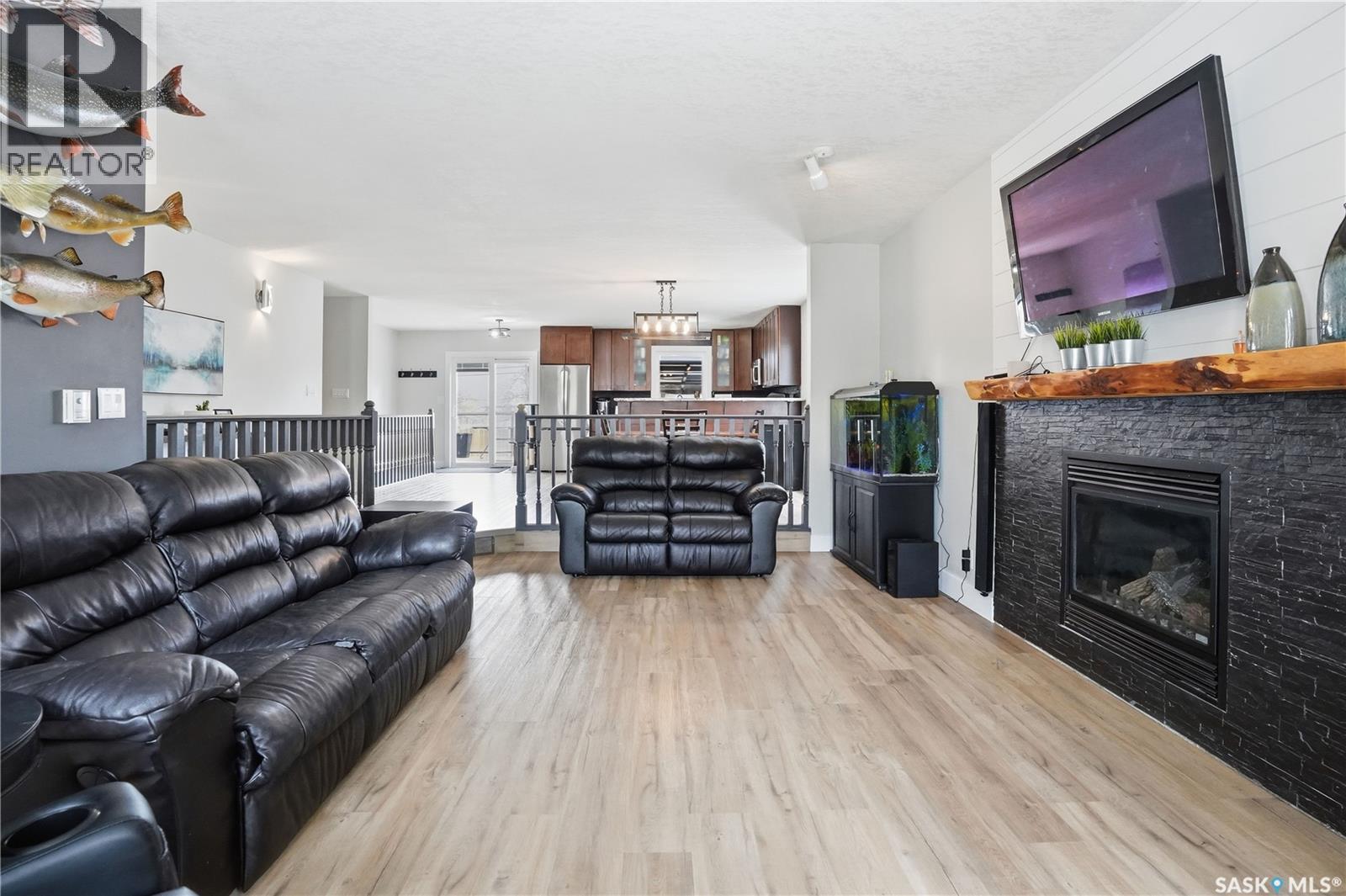 165 3Rd Street, Pilot Butte, SK - Indoor Photo Showing Living Room With Fireplace