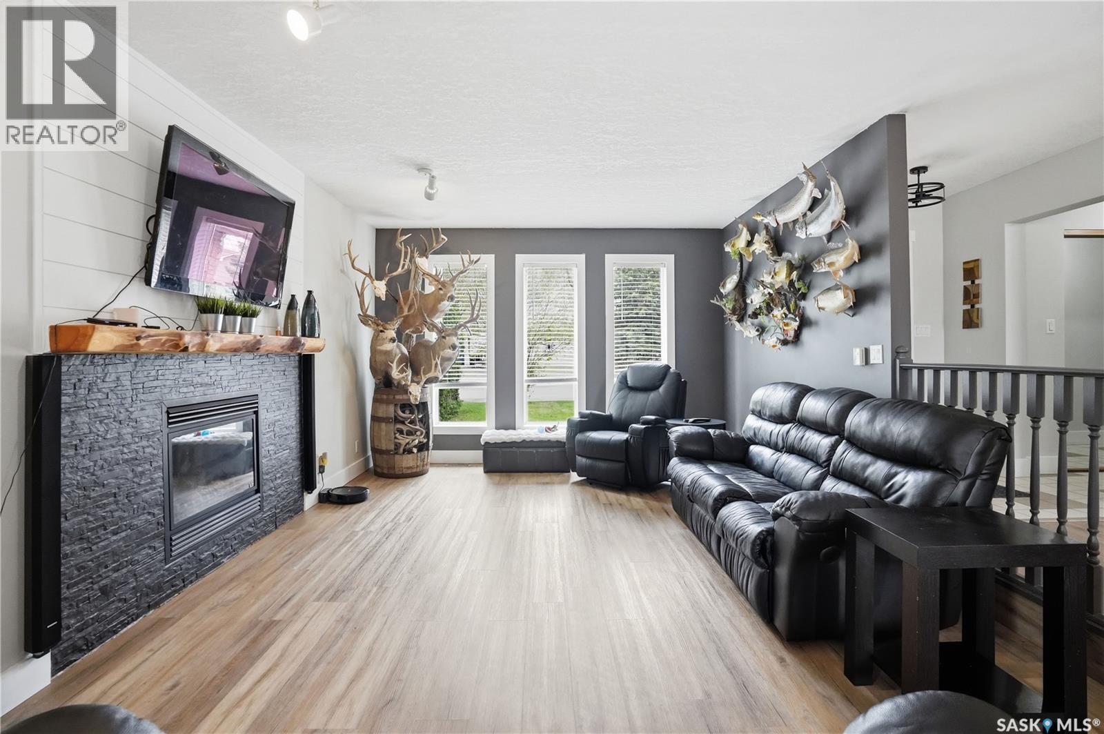 165 3Rd Street, Pilot Butte, SK - Indoor Photo Showing Living Room With Fireplace