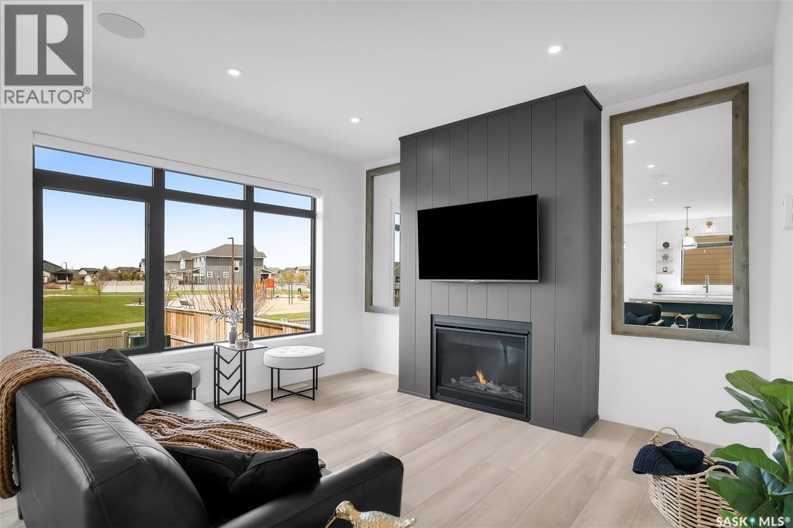255 Greyeyes-Steele Way, Saskatoon, SK - Indoor Photo Showing Living Room With Fireplace