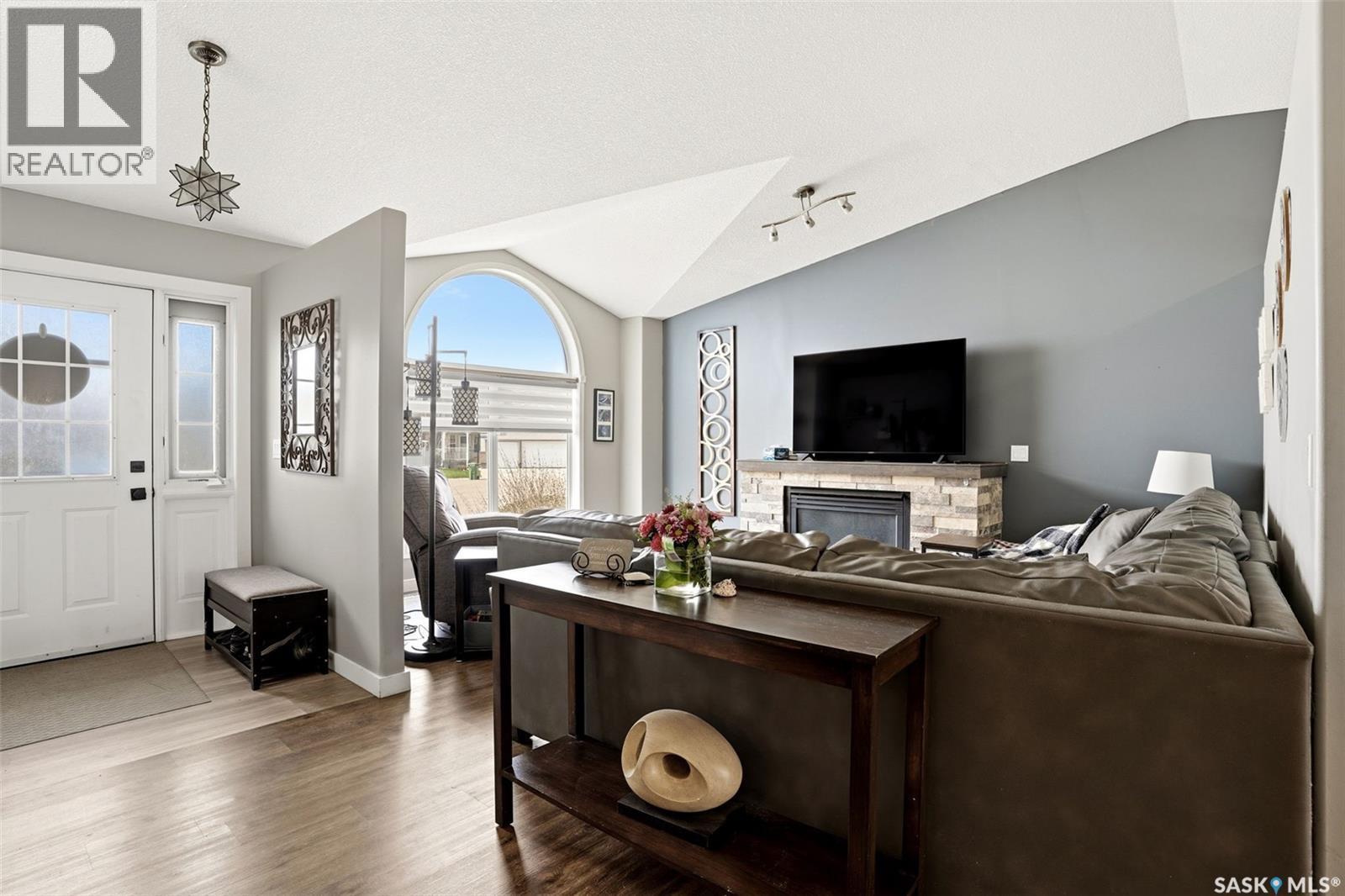 1248 Boehm Bay N, Regina, SK - Indoor Photo Showing Living Room With Fireplace