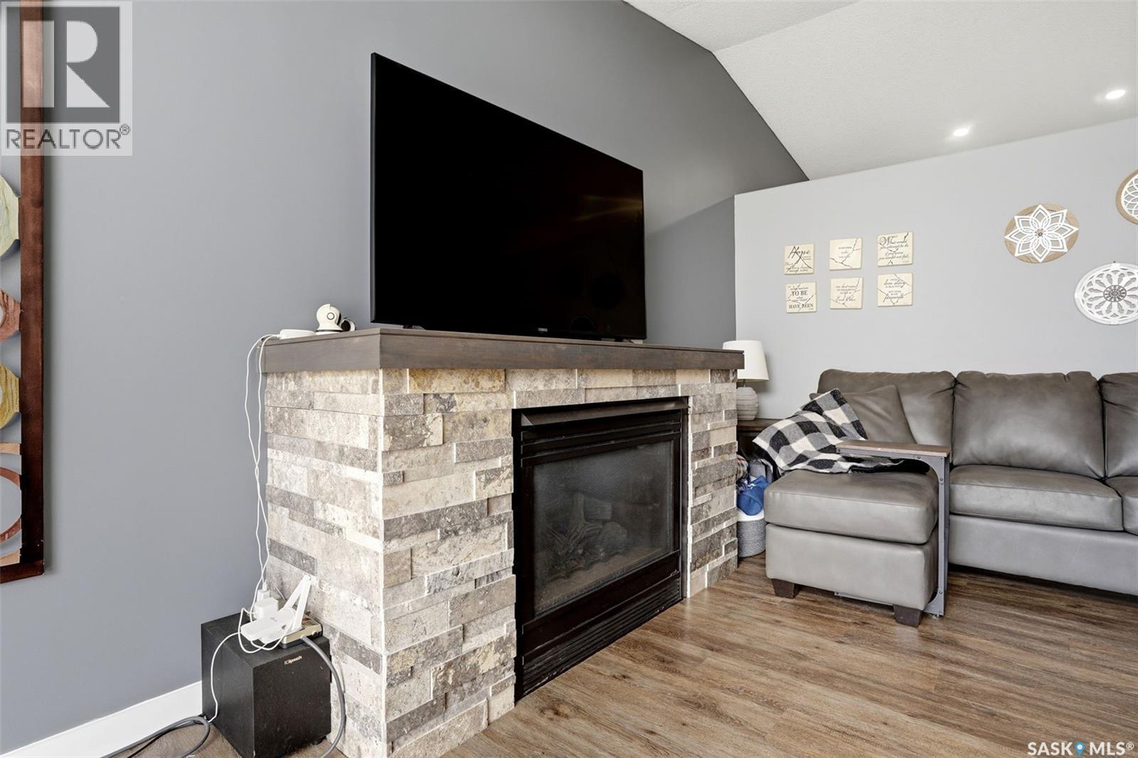1248 Boehm Bay N, Regina, SK - Indoor Photo Showing Living Room With Fireplace