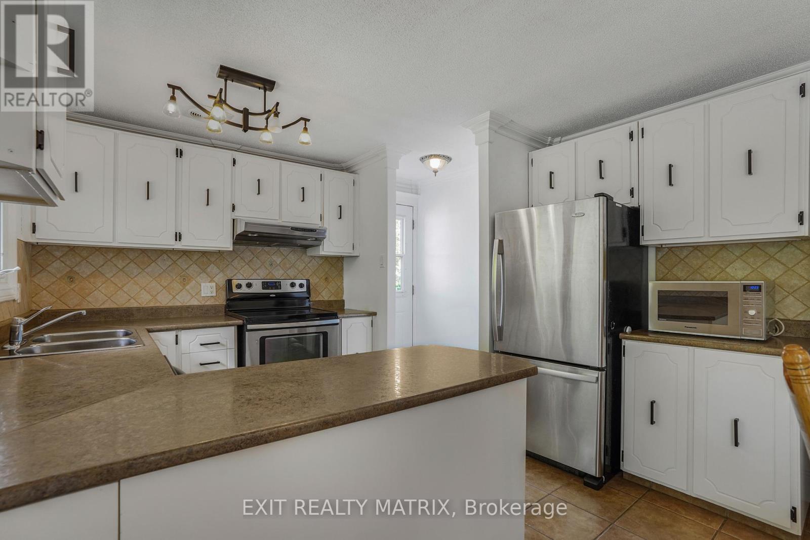 136 Martel Crescent, Champlain, ON - Indoor Photo Showing Kitchen With Double Sink