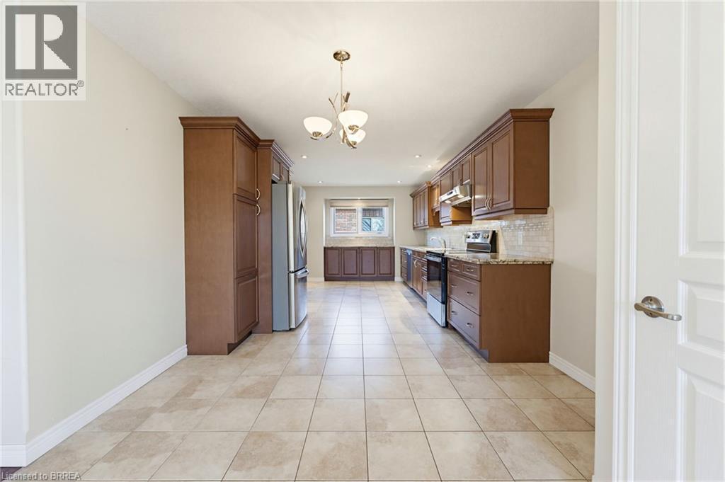 Kitchen featuring extensive cabinetry, stainless steel appliances, and granite countertops - 6 General Street, Brantford, ON - Indoor Photo Showing Kitchen