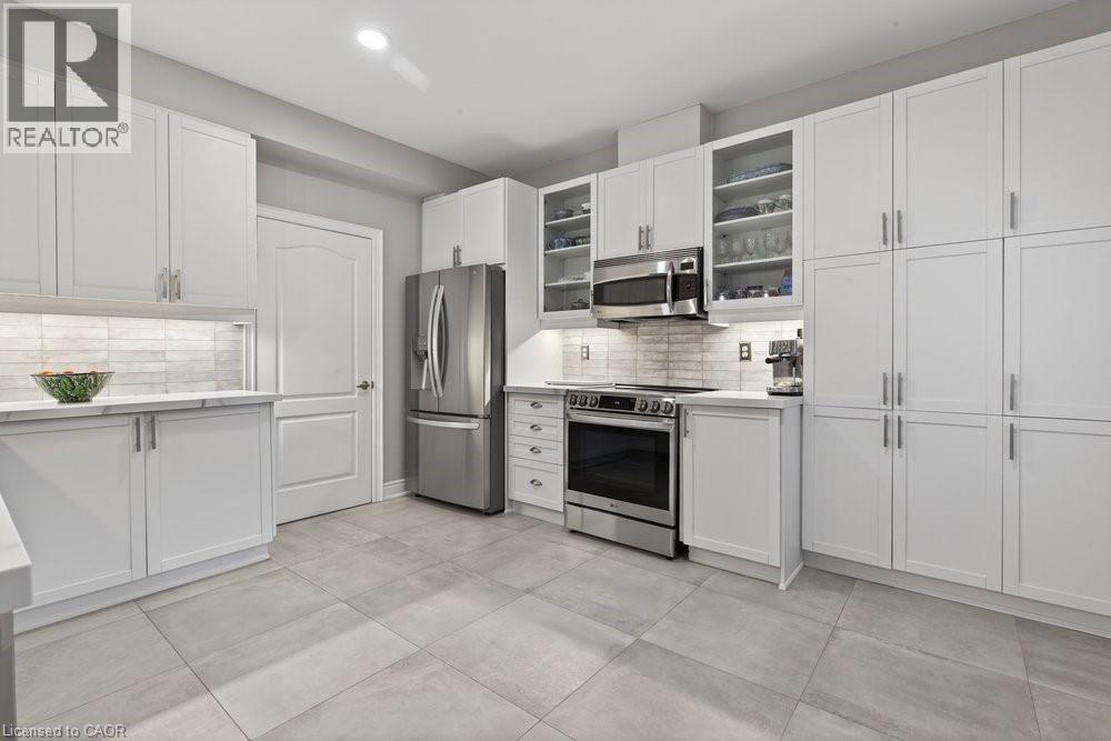 recent 16""x16"" porcelain tile floors - 100 Beddoe Drive Unit# 101, Hamilton, ON - Indoor Photo Showing Kitchen With Stainless Steel Kitchen